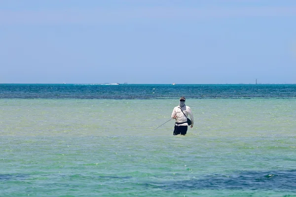 Fisherman standing in the sea — Stock Photo, Image