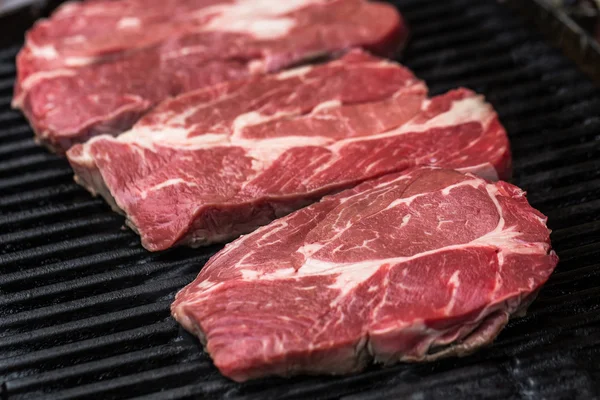 Fresh beef steaks on grill or BBQ — Stock Photo, Image