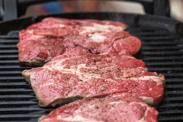 Fresh beef steaks on grill or BBQ — Stock Photo, Image