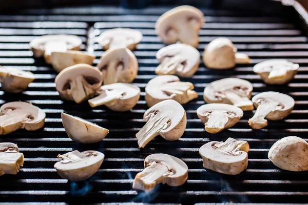 Champignon mushrooms on grill — Stock Photo, Image