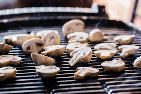 Champignon mushrooms on grill — Stock Photo, Image