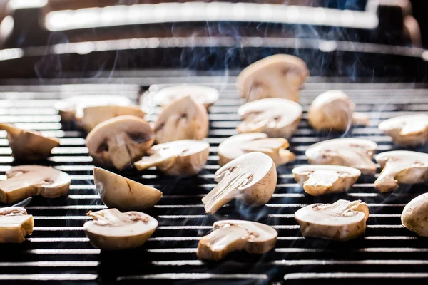 Champignon mushrooms on grill — Stock Photo, Image