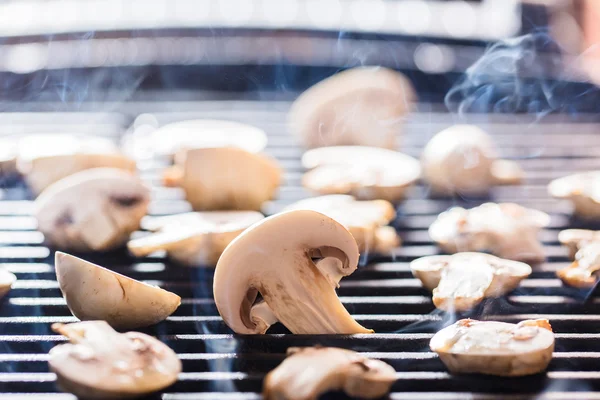 Champignon mushrooms on grill — Stock Photo, Image