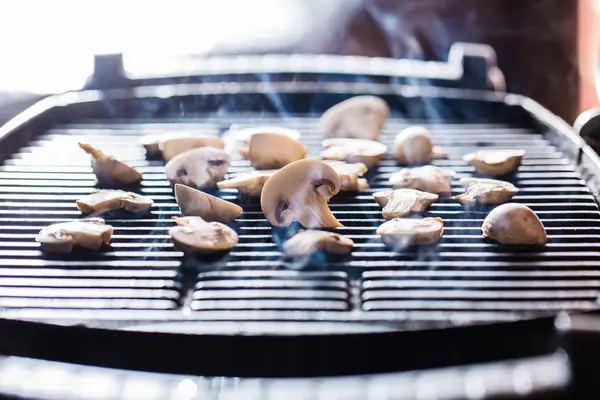 Champignon mushrooms on grill — Stock Photo, Image