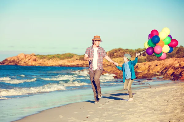 Happy father and son having great time on the beach in sunset light — Stock Photo, Image
