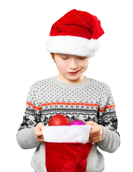 Portrait of a boy in christmas hat holdink white blank. Isolated — Stock Photo, Image