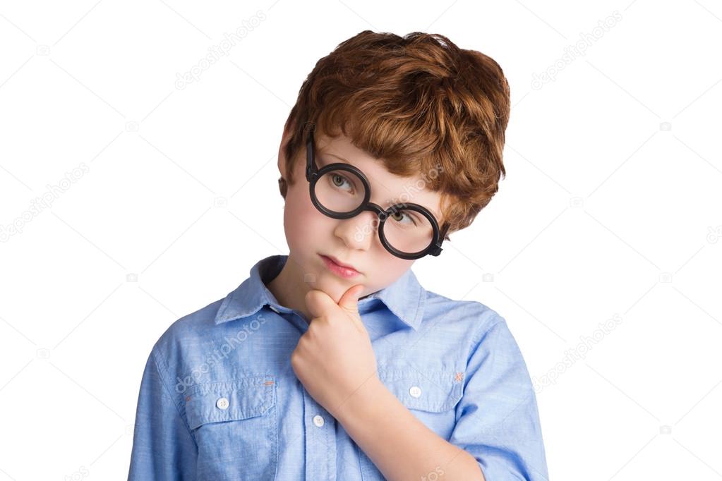 Portrait of handsome boy in round glasses thinking about something. Isolated on white background