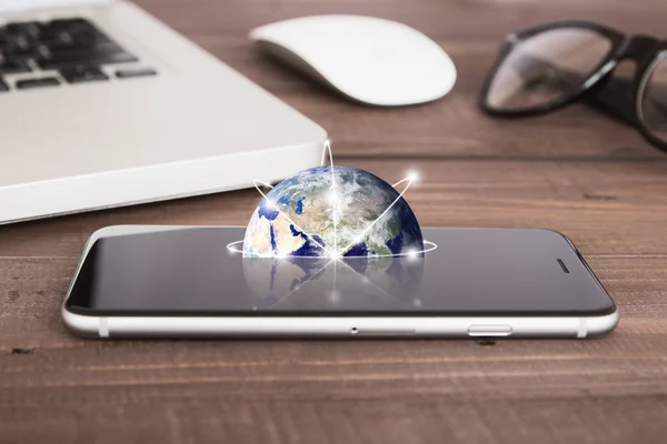 Earth on phone screen network concept elements of this image fur — Stock Photo, Image