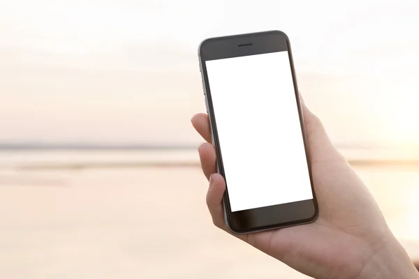 Phone in female hand at outdoor — Stock Photo, Image