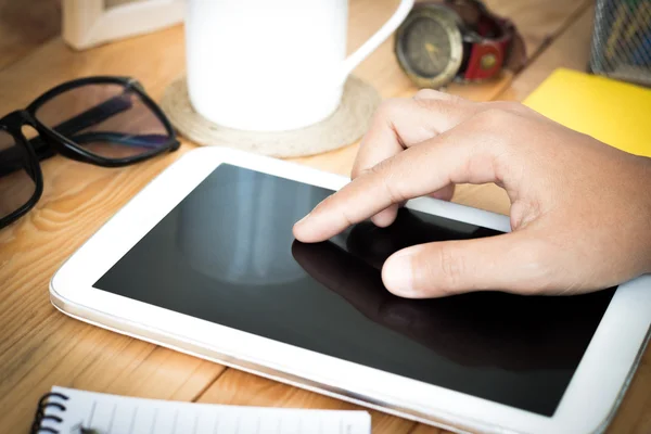 Closeup hand using digital tablet on workspace — Stock Photo, Image