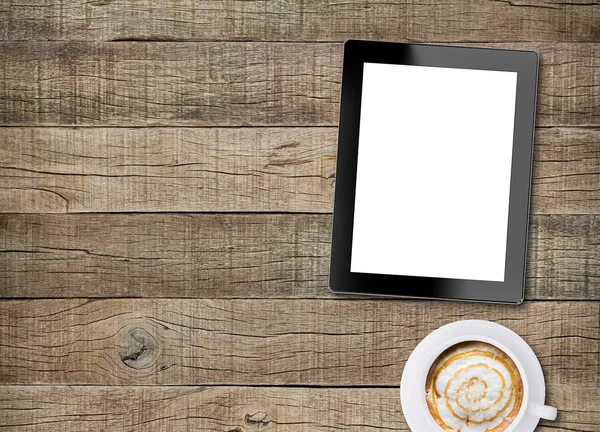 Tablet white screen display and coffee on old wood background — Stok fotoğraf