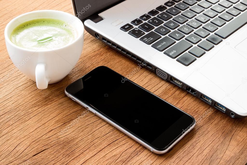 closeup black phone on desk