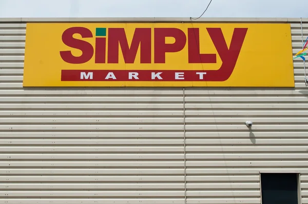 "egyszerűen piac "jelzések a sorompó Wall — Stock Fotó