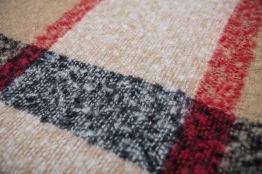 Bej ve siyah yün eşarp dokusuna yakın çekim