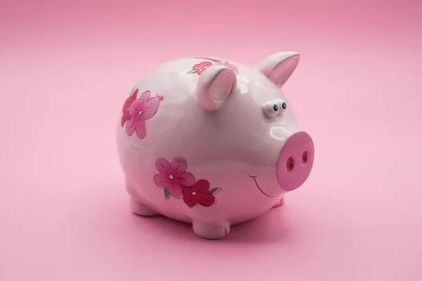 Closeup Pink Flowers Piggy Bank Front View Pink Background — Stock Photo, Image