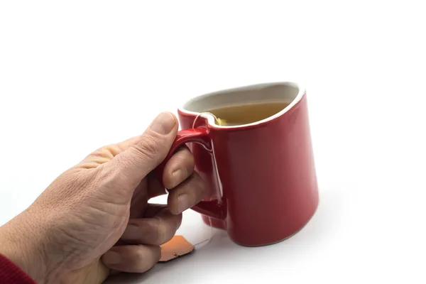 Closeup Red Ceramic Mug Tea Shaped Heart Hand White Background — Stock Photo, Image