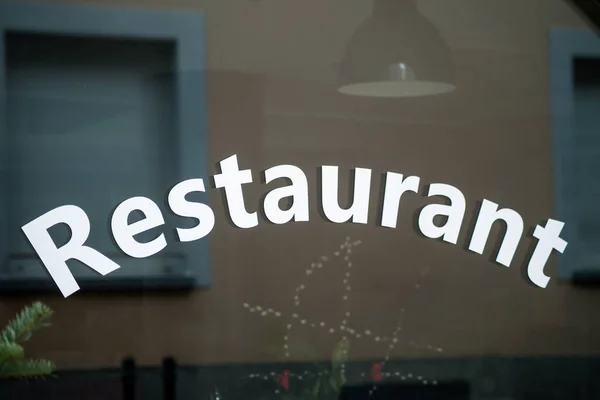 Closeup of restaurant signage on the window