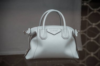 Mulhouse - France - 24 May 2021 - Closeup of white leather handbag by Givenchy in a luxury fashion store showroom 