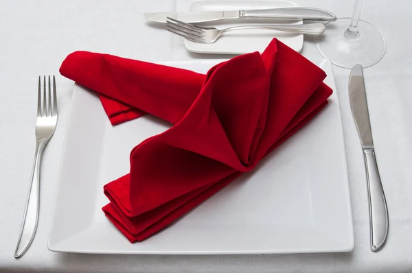 Silverware on red napkin decoration table in restaurant — Stock Photo, Image