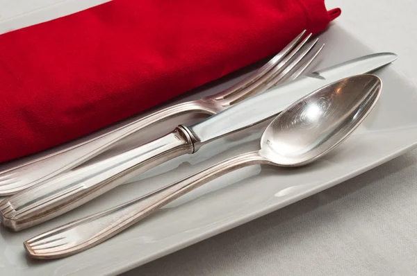 Silverware on red napkin decoration table in restaurant