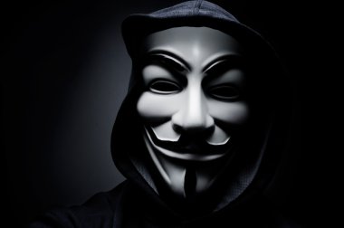 Photo of man wearing Vendetta mask. This mask is a well-known symbol for the online hacktivist group Anonymous. Also used by protesters. clipart