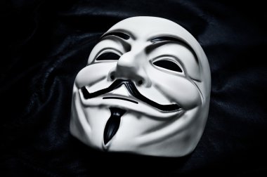 Paris - France - 18 January 2015 - Vendetta mask on black background . This mask is a well-known symbol for the online hacktivist group Anonymous clipart