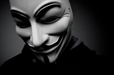 Paris - Fransa - 18 Ocak 2015 - kan davası maskesi giyen adam. Bu maske online hacktivist grubu Anonymous için iyi bilinen bir semboldür