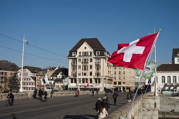 BASEL - Switzerland - 11 February 2015 - Mittlere Brucke Bridge with Switzerland flag — Stock Photo, Image