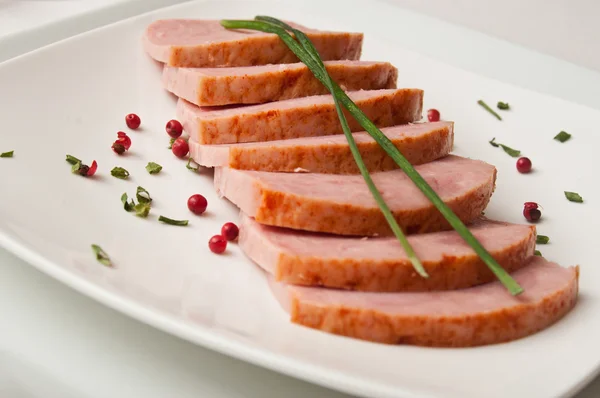 Roasted turkey sliced on a white plate — Stock Photo, Image