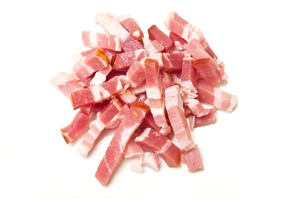 Kostičky slaniny na bílém pozadí — Stock fotografie