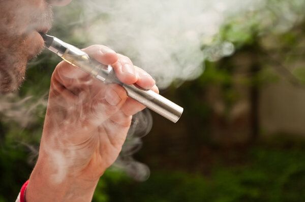 Man with e-cigarette in outdoor