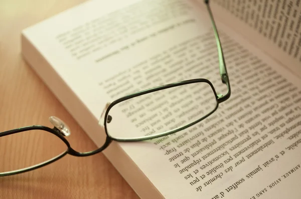 Glasses on a book closeup Royalty Free Stock Photos
