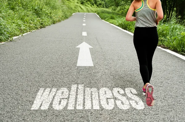Concept signage with running girl on the road the wellness and good health