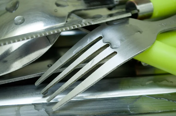 Wet silverware on Stainless steel sink — Stock Photo, Image