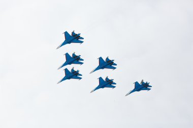 Aerobatics performed by aviation group of aerobatics Military-air forces Russian Knights on planes Su-27  clipart