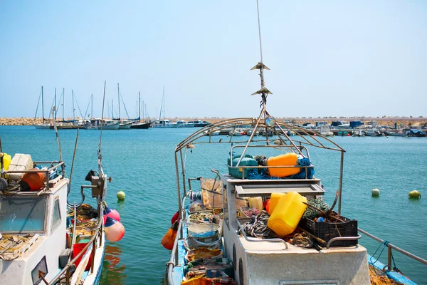 Small fishing boats in port with fishing net and equipment — Stock Photo, Image