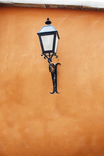 Old street lamp on a wall. — Stock Photo, Image