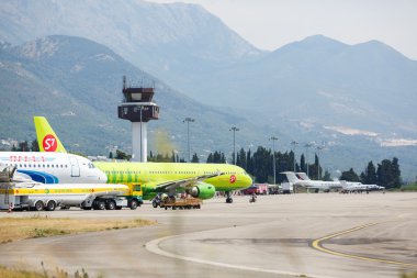 Tivat, Montenegro - August 8, 2015 : Airplanes preparing to flight in Tivat International Airport clipart