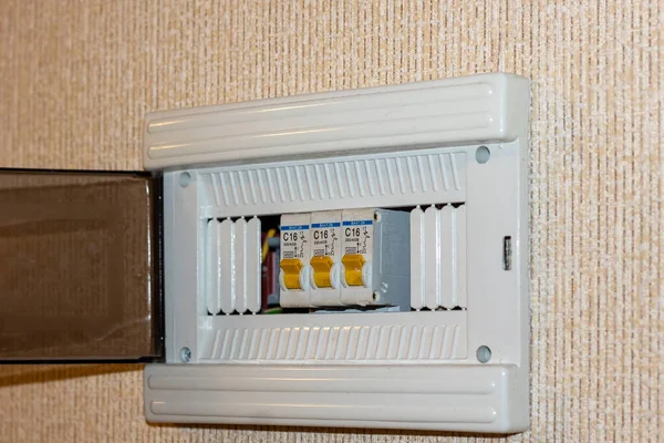 Close-up of an electrical panel with circuit breakers in the apartment. Voltage distributor with circuit breakers