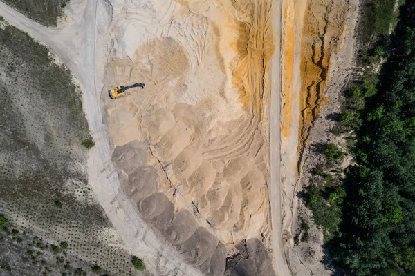 Sand pit quarry with big excavator, digger. Heavy machinery industry in Europe, Poland. Ecology and environmental. Aerial drone photo View