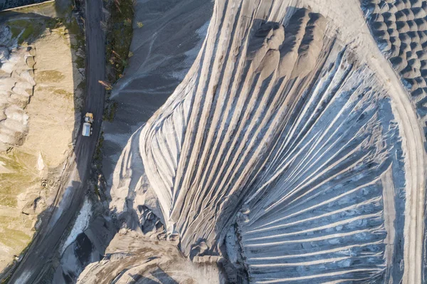 Sand pit quarry with big excavator, digger. Heavy machinery industry in Europe, Poland. Ecology and environmental. Aerial drone photo View