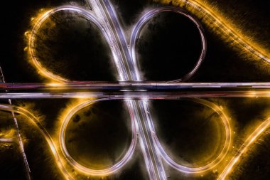 Ring road illuminated at night aerial drone photo view. Dabrowa Gornicza, Silesia Poland  clipart