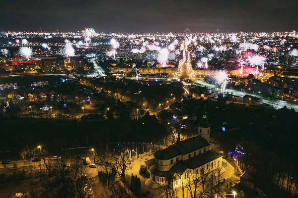 Many fireworks new year celebration in the city. New year, fete, picnic fireworks show. Dabrowa gornicza, silesia poland aerial drone photo view