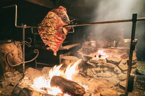 Large chunk of meat roasted on a fire. Dinner main dish fat pork. Traditional polish famous cuisine