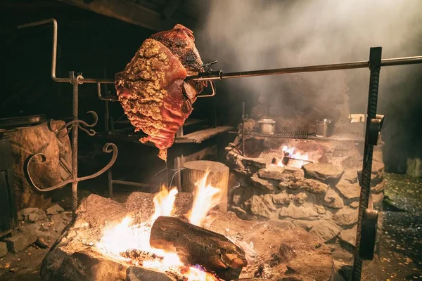 Large chunk of meat roasted on a fire. Dinner main dish fat pork. Traditional polish famous cuisine