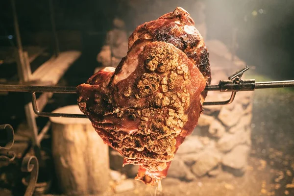 Large chunk of meat roasted on a fire. Dinner main dish fat pork. Traditional polish famous cuisine