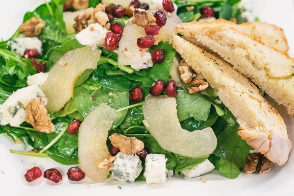 Pear Salad with Dried Cherries, Candied Walnuts and gorgonzola cheese. Caramelized pear salad with Walnuts