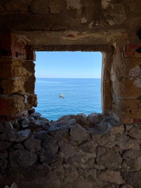 Capo Zafferano Italian coastal promontory and lighthouse by the Tyrrhenian Sea in Bagheria, Sicily Italy with rugged cliffs lush Mediterranean flora crystal clear water.