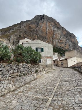 Caltavuturo, a historic Sicilian mountain town in the Madonie Mountains, featuring its medieval castle, charming narrow streets, and traditional stone houses, Sicily, Italy. Italian town in hills.