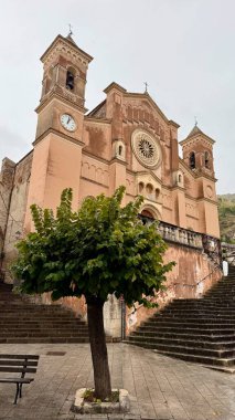 Collesano, a historic Sicilian mountain town in the Madonie Mountains, featuring narrow stone streets, traditional houses, and the Church of San Pietro, Sicily, Italy. Italian town in hills.